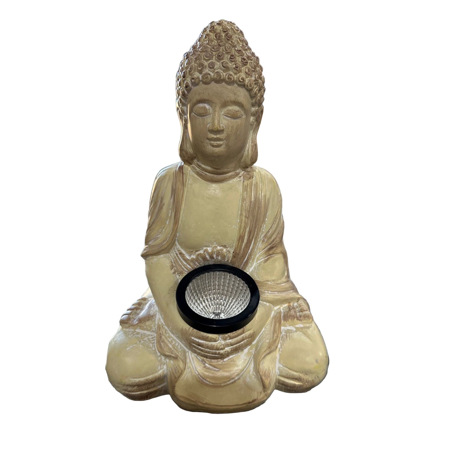 Buddha statue with solar light on a reflective surface
